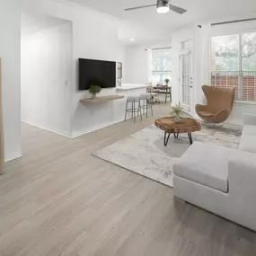 Open floor plan with wood style flooring throughout at Camden Addison apartments in Addison, TX