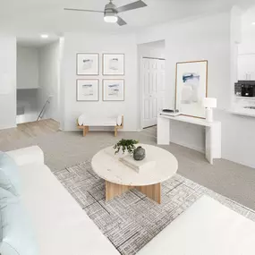 Living room with private stair access in townhome style layout at Camden Addison apartments in Addison, TX