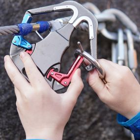 At Quarry Park Adventures, guests use the SmartSnap continuous attachment device to safely traverse the challenge elements. The SmartSnap is a self-belay system which allows the user to adventure without ever being able to detach from the safety line.