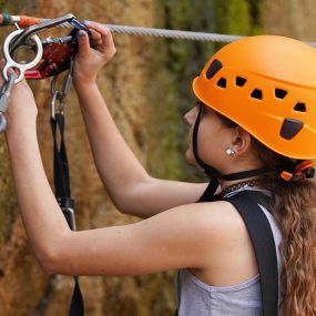 Quarry Park Adventures uses the SmartSnap continuous attachment device, a self-belay system which allows the user to traverse all of the individual elements of a course, without ever being able to detach from the safety line.