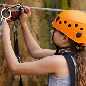 Quarry Park Adventures uses the SmartSnap continuous attachment device, a self-belay system which allows the user to traverse all of the individual elements of a course, without ever being able to detach from the safety line.