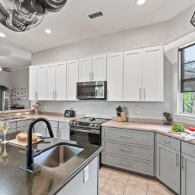 white and gray two-tone cabinets