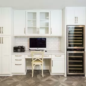 White counter and white cabinets.