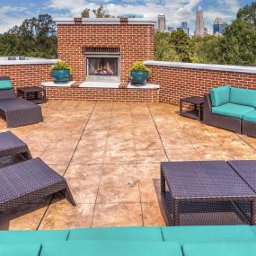 Private rooftop terrace with plenty of lounge seating and fireplace