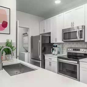 Kitchen with white quartz countertops