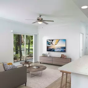 Living room with sliding glass doors to screened patio wood look flooring and ceiling fan