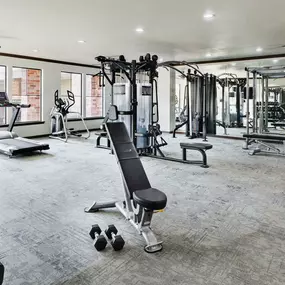 24 hour fitness center with cardio equipment and free weights at Camden Heights Apartments in Houston, TX