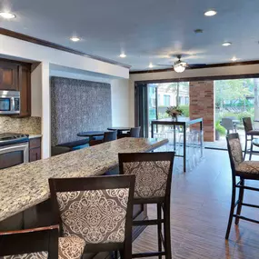 Resident lounge with kitchen entertaining space at Camden Heights Apartments in Houston, TX