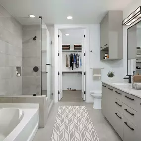 Warm modern finishes bathroom with stand up shower and soaking tub