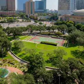 Root square park with basketball court and green space