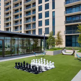 Relaxation courtyard with life size chess and hammocks