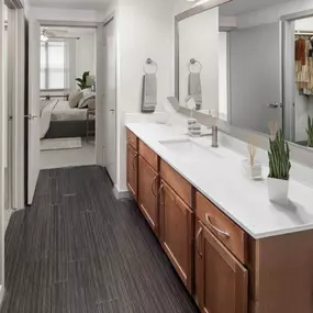 Bathroom with white quartz countertops at Camden Design District apartments in Dallas, TX