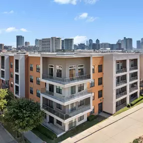 Exterior view of Camden Design District with the Dallas skyline in the background