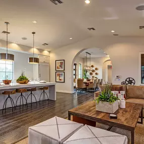 Resident dining lounge with barstool seating chefs kitchen and dining areas