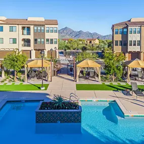 Resort style swimming pool with cabanas and lounging areas