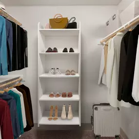 Camden Foothills Apartments Scottsdale AZ spacious walk-in closet with built-in wooden shelves and rods