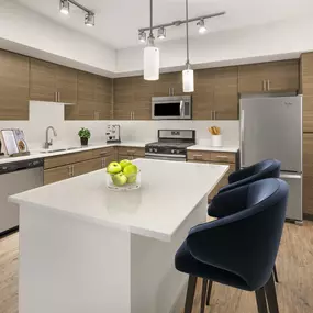 Camden Foothills Apartments Scottsdale AZ kitchen with island and stainless steel appliances