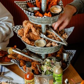Gluten free fried chicken tower with chicken tenders, chicken wings, fried bird and more