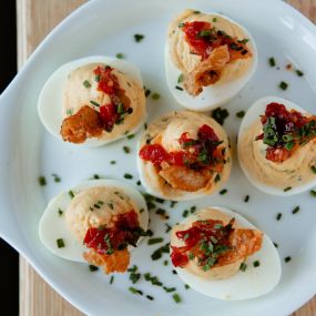 Deviled Eggs topped with crispy chicken skin