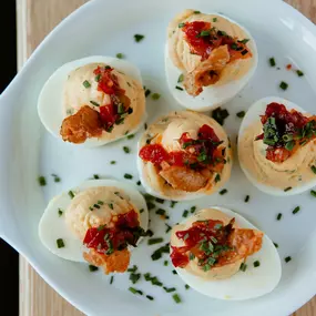 Deviled Eggs topped with crispy chicken skin