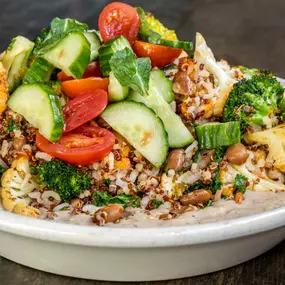 Vegetarian Track Suit Veggie Bowl Quinoa, kale, arugula, roasted sweet potatoes, pickled red onions, tomatoes, cucumbers, toasted sesame & sunflower crunch, white balsamic vinaigrette