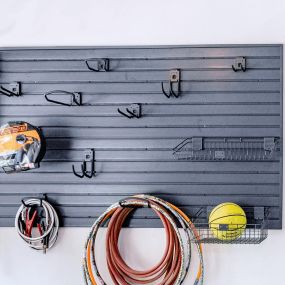 Use handiwall and accessories  to get items off the floor and organize your garage workspace.