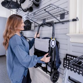 Slat wall is the new peg board.  Many attractive options to get things off the garage floor!