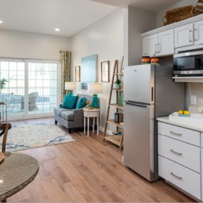 kitchen and living room in assisted living apartment