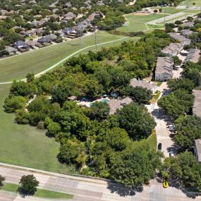 Aerial view of Camden Legacy Creek apartments in Plano, TX bordering park and trail
