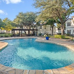 Second pool and sundeck with grilling area and poolside seating at Camden Legacy Creek