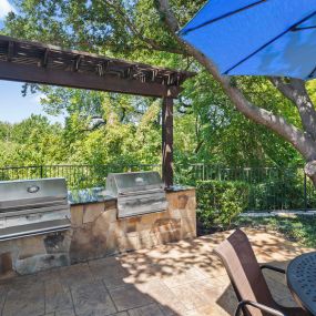 Poolside grills at Camden Legacy Creek apartments in Plano, TX