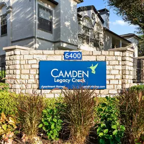 Entry sign in front of a building at Camden Legacy Creek