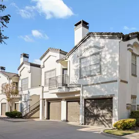 Building exterior with garages and balconies at Camden Legacy Creek