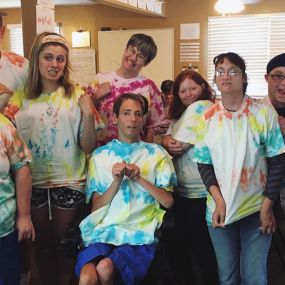 Participants at Murray Greenhouse Foundation in Utah having a blast making tie-dyed shirts. Our program for disabled adults provides fun, skills, and socialization.