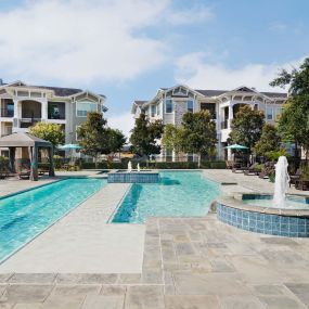 Resort-style pool with fountains at Camden Northpointe Apartments in Tomball, TX