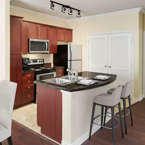 Kitchen with breakfast bar at Camden Northpointe in Tomball, TX