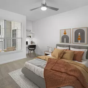 Bedroom with built in desk, modern ceiling fan and carpet at Camden Northpointe Apartments in Tomball, Tx.