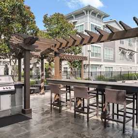 BBQ grills by the pool at Camden Northpointe apartments in Tomball, TX