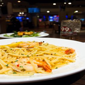 Shrimp Scampi: Jumbo shrimp prepared scampi-style, served with linguine aiolio and a choice of side.