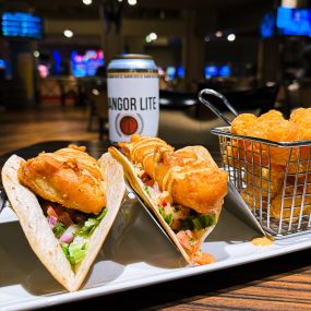 Fried Fish Tacos: Sam Adams beer-battered haddock with fresh salsa, shaved lettuce and chipotle ranch on warm flour tortillas.