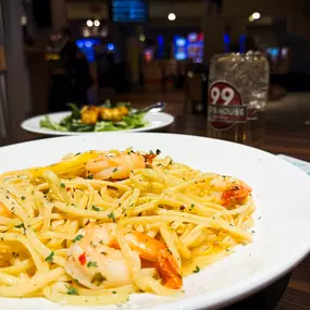 Shrimp Scampi: Jumbo shrimp prepared scampi-style, served with linguine aiolio and a choice of side.