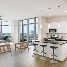 Kitchen with quartz countertops and large kitchen islands and skyline views