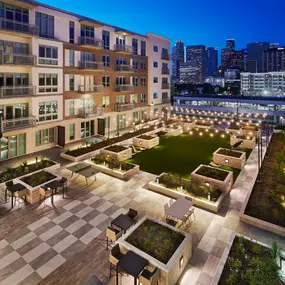 Outdoor lounge with downtown view night