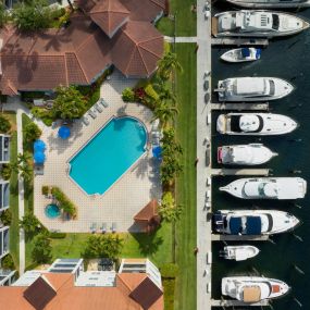 Downward view of pool and marina at Camden Aventura apartments in Aventura, Florida.