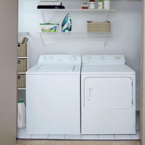 Full size washer and dryer with shelving