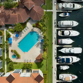 Downward view of pool and marina at Camden Aventura apartments in Aventura, Florida.