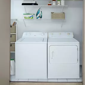 Full size washer and dryer with shelving