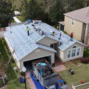 Residential roof replacement in progress by Noland's Roofing in Clermont, FL, featuring underlayment installation on a single-story home.