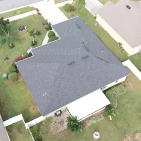Completed shingle roof installation in Orange City, FL by Noland's Roofing, showcasing clean lines and expert craftsmanship on a residential property