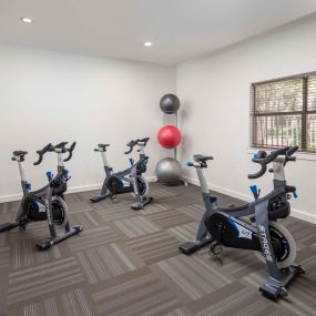 Spin room with spin bikes, weighted balls and yoga balls at Camden Stoneleigh
